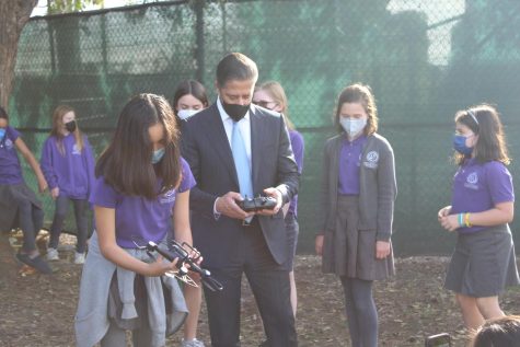 New LAUSD Superintendent Alberto Carvalho works with a GALA Aerospace student to fly a drone.